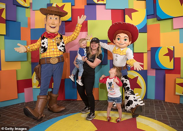 Family Fun: The American Idol heroine appears with her children Remington and River in April 2018 at Disneyland in Anaheim, California.