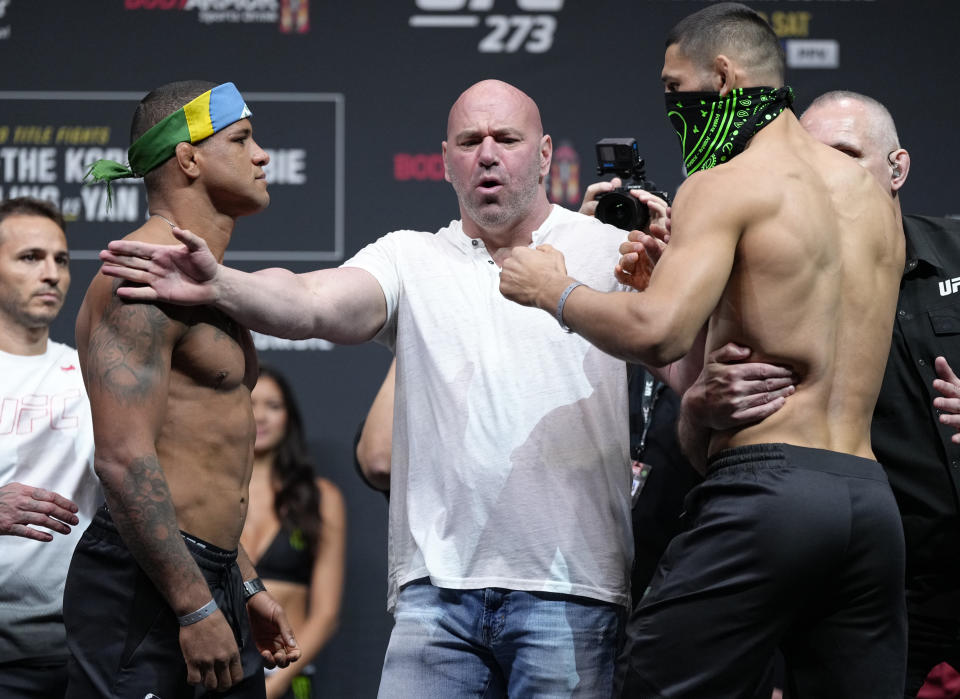 JACKSONVILLE, FL - APRIL 8: (From left to right) antagonists Gilbert Burns of Brazil and Khameev Shemayev of Russia face off during the ceremonial UFC 273 weight ceremony at the VyStar Veterans Memorial Arena on April 8, 2022 in Jacksonville, Florida.  (Photo by Jeff Buttari/Zuffa LLC)