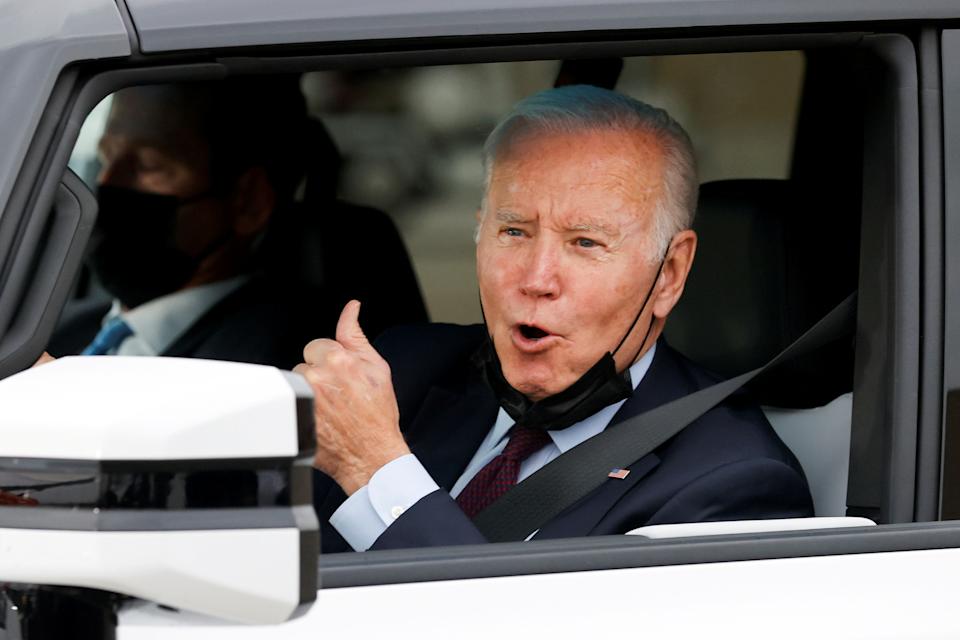 US President Joe Biden poses after driving a Hummer EV during a tour of General Motors' electric vehicle assembly plant in Detroit, Michigan, US, November 17, 2021. REUTERS / Jonathan Ernst TPX IMAGES OF THE DAY