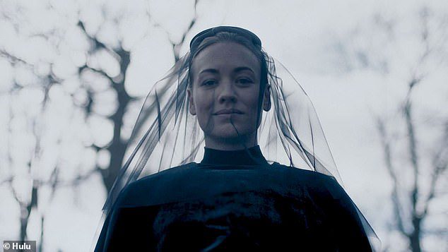 Interesting: Yvonne Strahovski, 39, character Serena - wife of Captain Waterford - because she doesn't look too upset as she can be seen smiling behind a black funeral veil