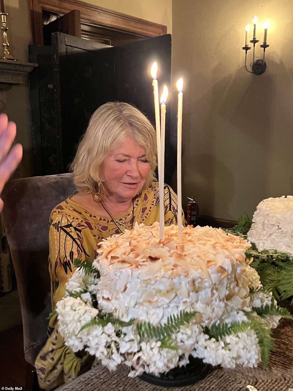 So delicious: her delicious cake appeared on three white candles