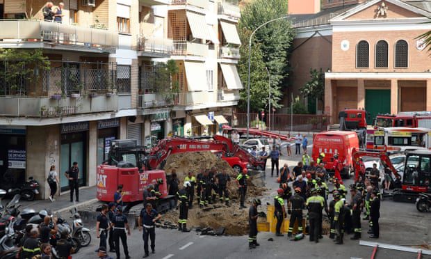 Rescue workers at the scene of the accident in Via Innocenzo XI