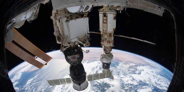 6, 2021, file photo provided by NASA, the International Space Station orbiting 264 miles above the Tyrrhenian Sea with the Soyuz MS-19 crew ship docked in the Rassvet module and the Prishal module, still attached to the Progressive Delivery Vehicle, mounted on the Multipurpose Nauka. 