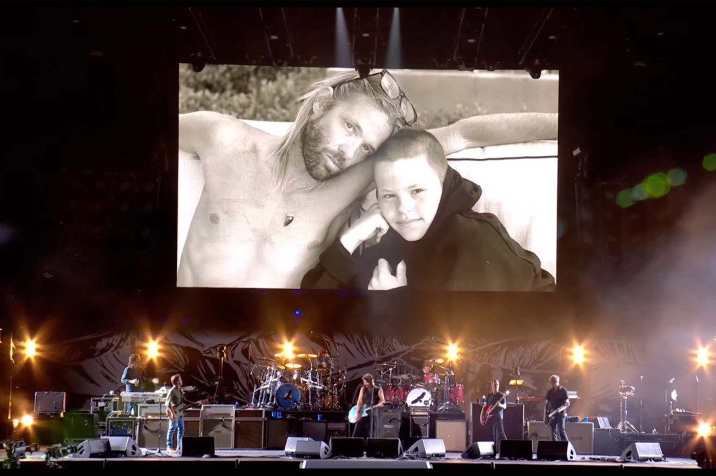 The crowd cheered when a picture of Hawkins and his son was shown on a screen behind the teenage drummer. 