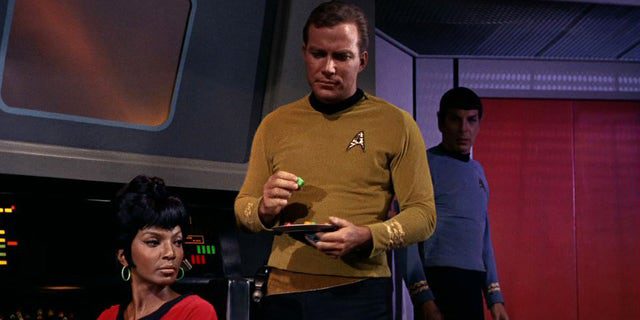 Nichelle Nichols (as Lieutenant Nyota Uhura) and William Shatner (as Captain James T. Kirk) are shown in a scene from "man trap" The first episode of "Star Trek" which was broadcast on September 8, 1966.