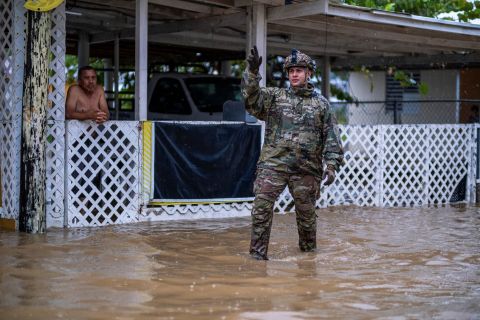 A Puerto Rican National Guard member searches for people in Salinas on Monday.
