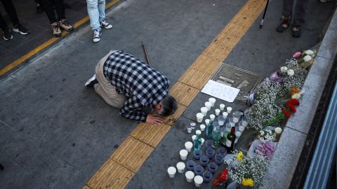 A mourner pays tribute to a temporary memory near the site of the stampede in Seoul on October 30.