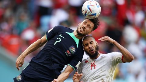 Matthew Leakey of Australia competes for a header against Aissa Ledouni of Tunisia during the Group D match between Tunisia and Australia.