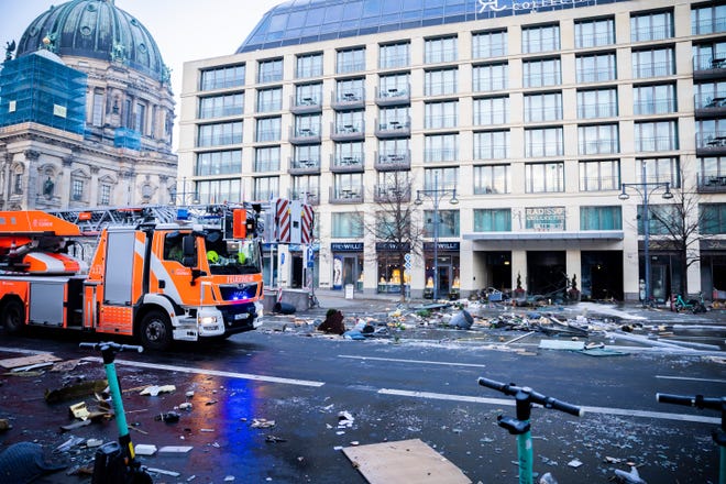 Debris in the street after a huge fish tank explodes at the Seal Life Aquarium in central Berlin, Germany, Friday, December 16, 2022. (Christoph Soeder/dpa via AP)